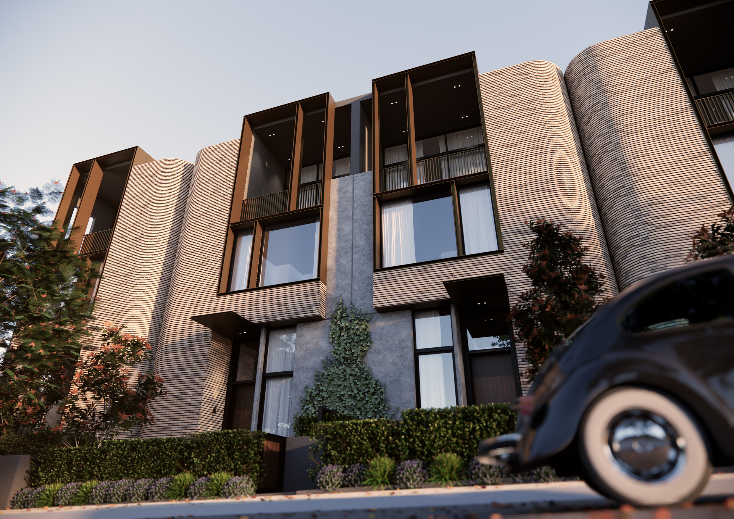 Low street view of Filaro showing curved brickwork, deep framed openings and planting