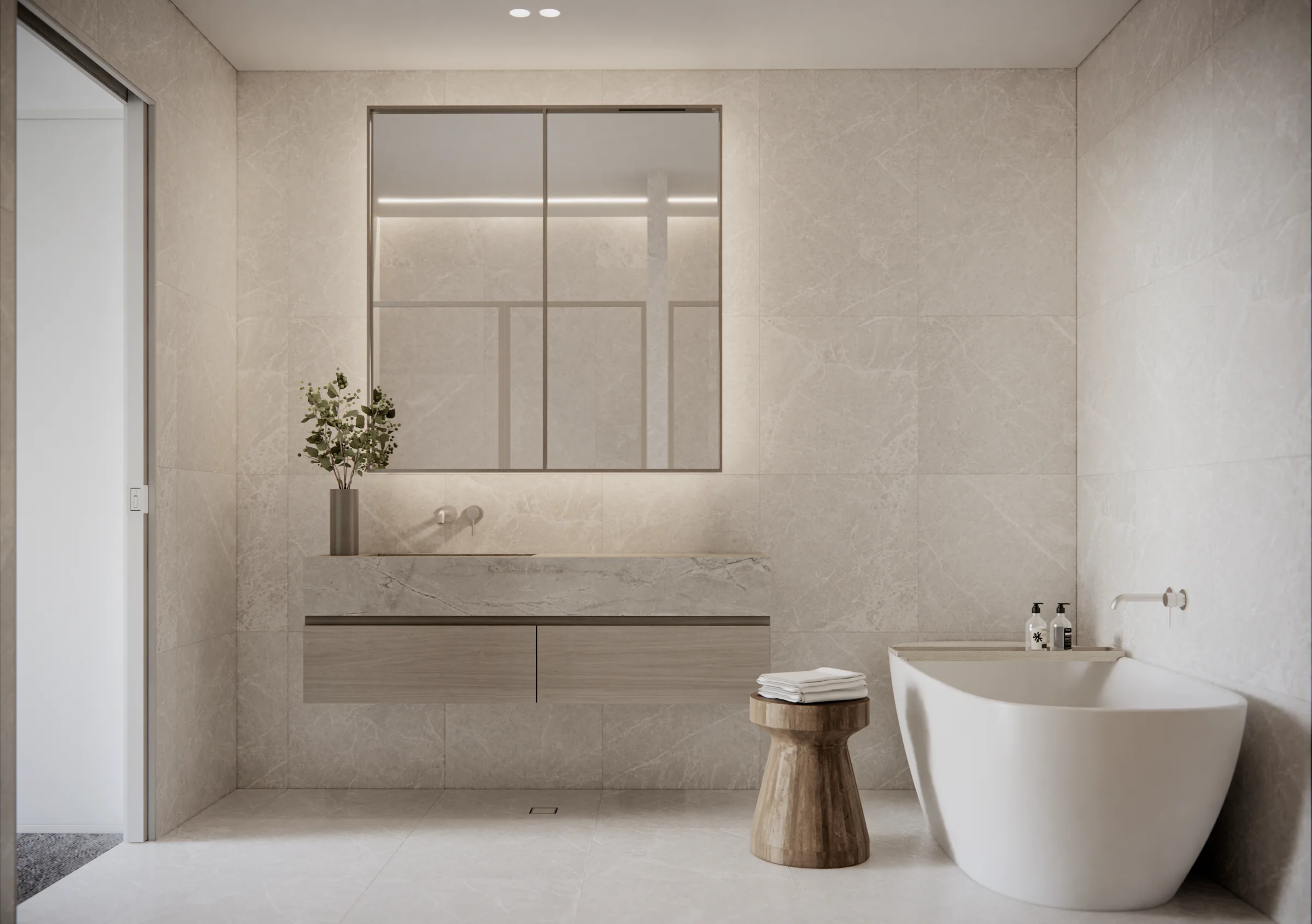 Filaro ensuite with stone vanity, mirrored cabinetry and freestanding bath
