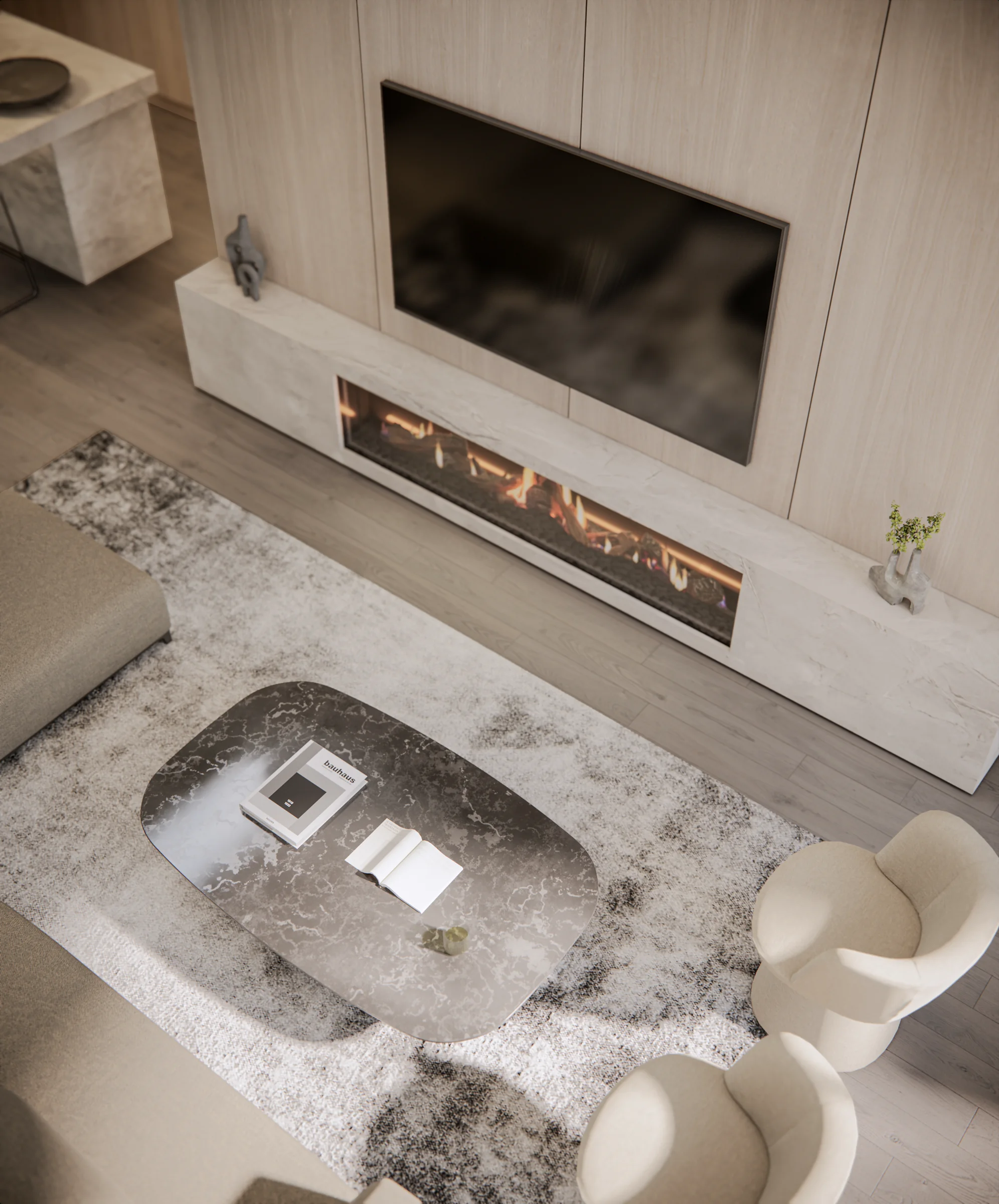 Overhead view of the Filaro living room, fireplace and stone coffee table